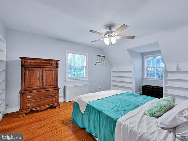 341 Creston Rd, York, PA 17403 - bedroom featuring multiple windows, light wood finished floors, radiator, and a wall mounted AC