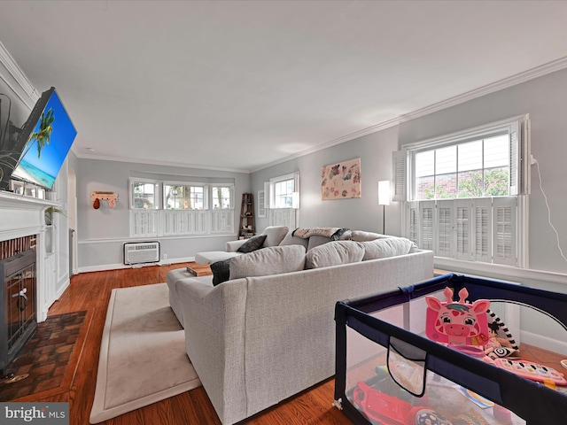 341 Creston Rd, York, PA 17403 - living area with crown molding, wood finished floors, and a brick fireplace