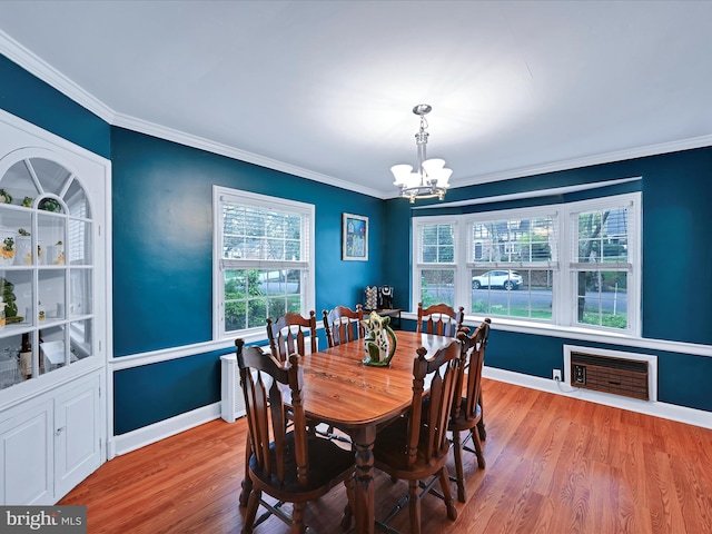 341 Creston Rd, York, PA 17403 - dining space with ornamental molding, baseboards, an inviting chandelier, and wood finished floors