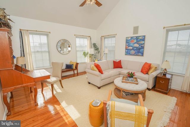 13470 Harrison Landing Rd, Princess Anne, MD 21853 - living room with light wood-type flooring, high vaulted ceiling, and a ceiling fan