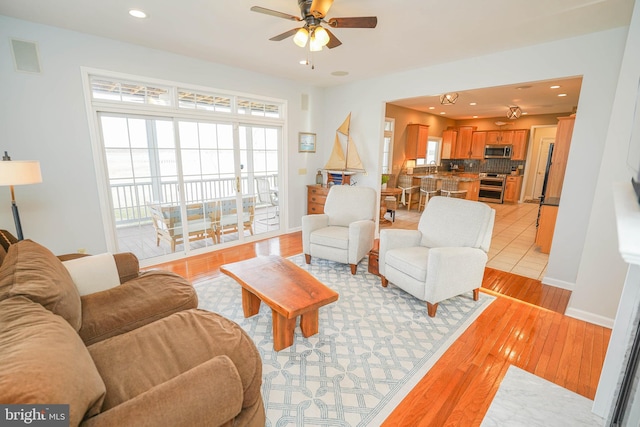13470 Harrison Landing Rd, Princess Anne, MD 21853 - living area featuring light wood-type flooring, plenty of natural light, recessed lighting, and ceiling fan