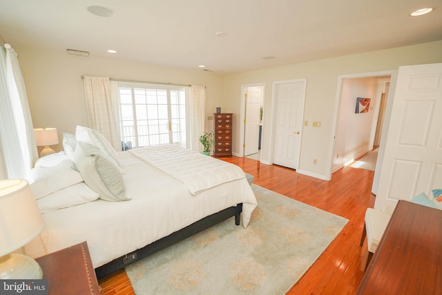 13470 Harrison Landing Rd, Princess Anne, MD 21853 - bedroom featuring baseboards, wood finished floors, and recessed lighting