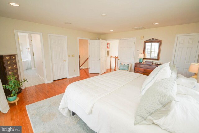 13470 Harrison Landing Rd, Princess Anne, MD 21853 - bedroom featuring baseboards, ensuite bath, recessed lighting, and wood-type flooring