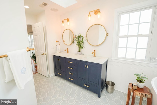 13470 Harrison Landing Rd, Princess Anne, MD 21853 - full bath featuring a sink, plenty of natural light, and visible vents