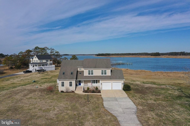13470 Harrison Landing Rd, Princess Anne, MD 21853 - view of front of house with a water view, a front lawn, concrete driveway, and covered porch