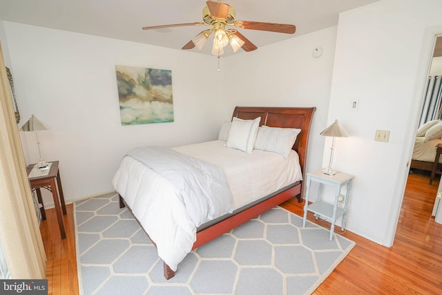 13470 Harrison Landing Rd, Princess Anne, MD 21853 - bedroom with baseboards, ceiling fan, and wood finished floors