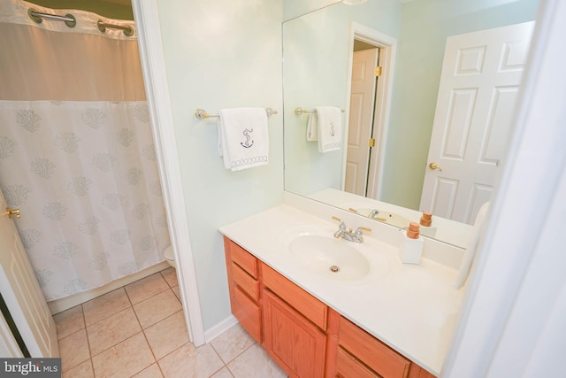 13470 Harrison Landing Rd, Princess Anne, MD 21853 - bathroom featuring vanity, toilet, a shower with shower curtain, baseboards, and tile patterned floors