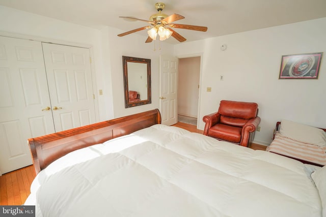 13470 Harrison Landing Rd, Princess Anne, MD 21853 - bedroom featuring a closet, light wood-style flooring, and a ceiling fan