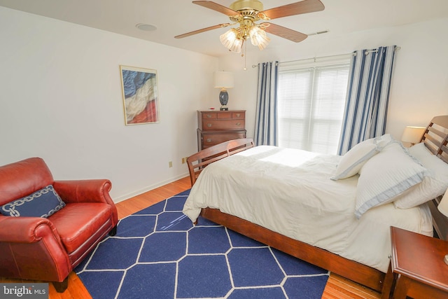 13470 Harrison Landing Rd, Princess Anne, MD 21853 - bedroom with baseboards, wood finished floors, and a ceiling fan