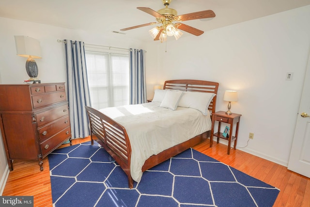 13470 Harrison Landing Rd, Princess Anne, MD 21853 - bedroom with baseboards, wood finished floors, and a ceiling fan