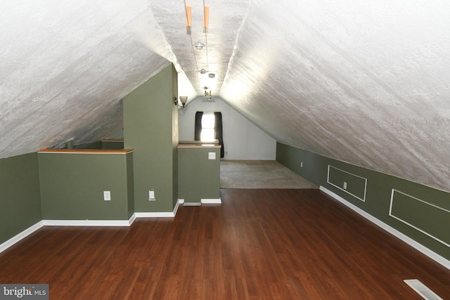 713 Cooper St, Florence, NJ 08518 - bonus room with baseboards, wood finished floors, and lofted ceiling