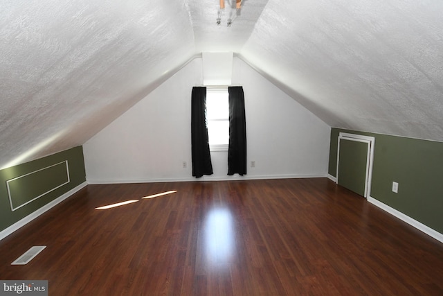 713 Cooper St, Florence, NJ 08518 - additional living space with lofted ceiling, a textured ceiling, visible vents, baseboards, and wood finished floors