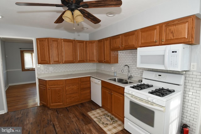 713 Cooper St, Florence, NJ 08518 - kitchen with light countertops, a sink, brown cabinetry, and white appliances