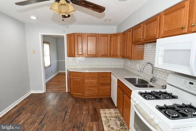 713 Cooper St, Florence, NJ 08518 - kitchen with a sink, brown cabinets, white appliances, a ceiling fan, and light countertops