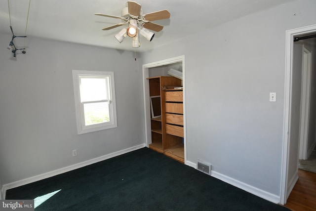 713 Cooper St, Florence, NJ 08518 - unfurnished bedroom with visible vents, dark carpet, ceiling fan, and baseboards