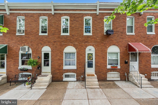 multi unit property with entry steps and brick siding