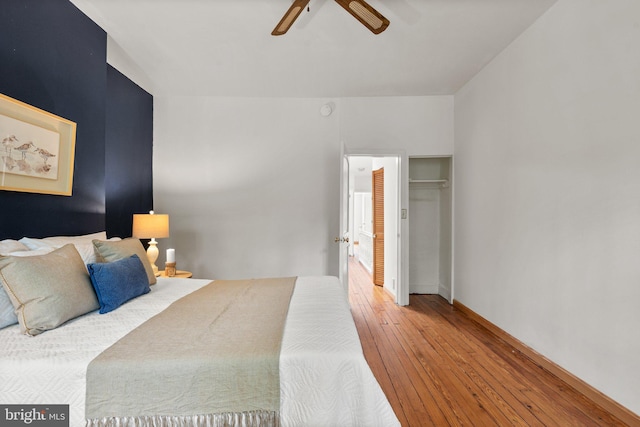 bedroom featuring wood-type flooring and ceiling fan