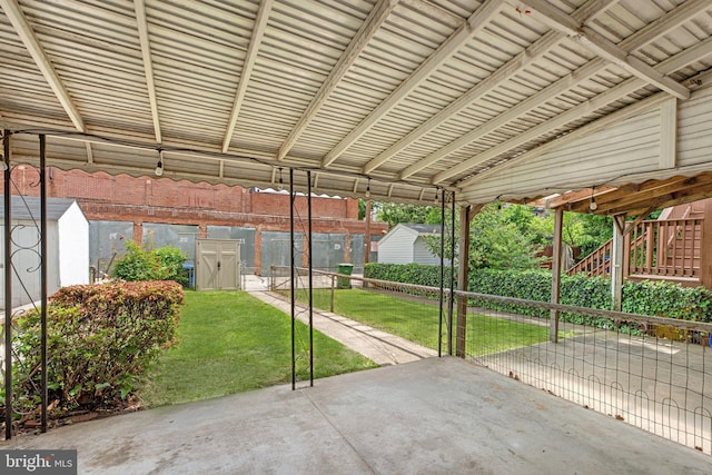 view of patio with a storage shed and an outdoor structure