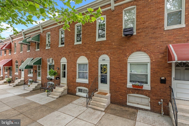 multi unit property with entry steps and brick siding