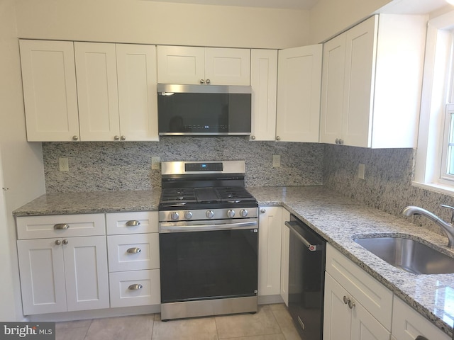 29 Pine Dr, Manchester, PA 17345 - kitchen with appliances with stainless steel finishes, a sink, and white cabinets