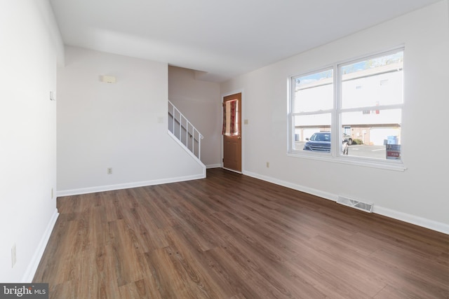 29 Pine Dr, Manchester, PA 17345 - unfurnished living room with stairs, wood finished floors, and baseboards