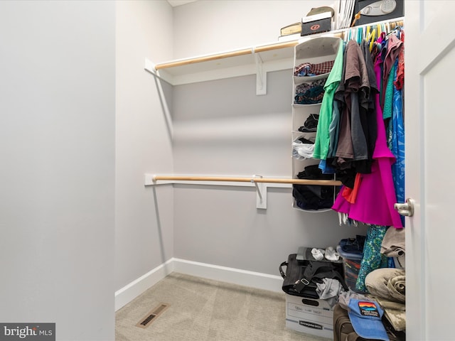 spacious closet with carpet and visible vents
