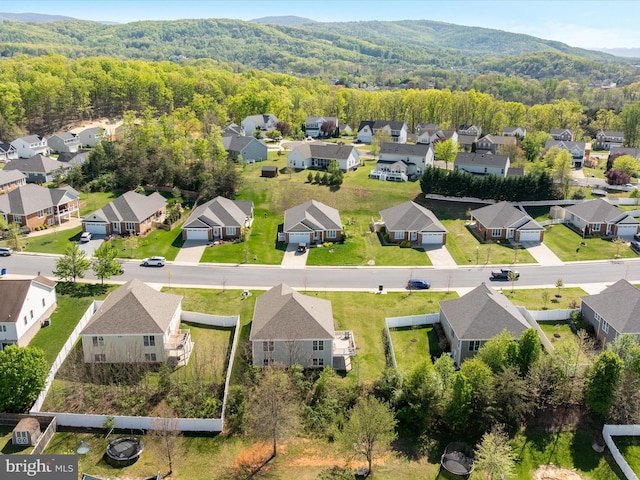 aerial view featuring a residential view, a forest view, and a mountain view
