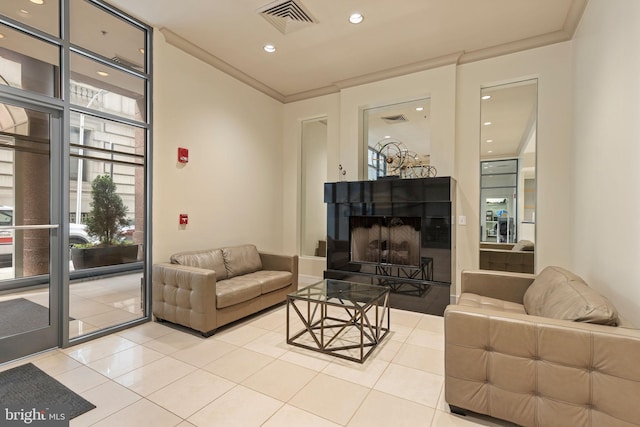 living room with light tile patterned flooring, ornamental molding, visible vents, and recessed lighting