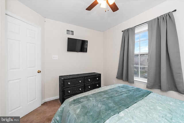 bedroom featuring baseboards, carpet floors, ceiling fan, and visible vents