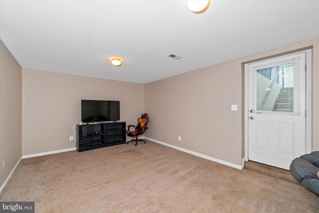 sitting room with baseboards, visible vents, and carpet floors