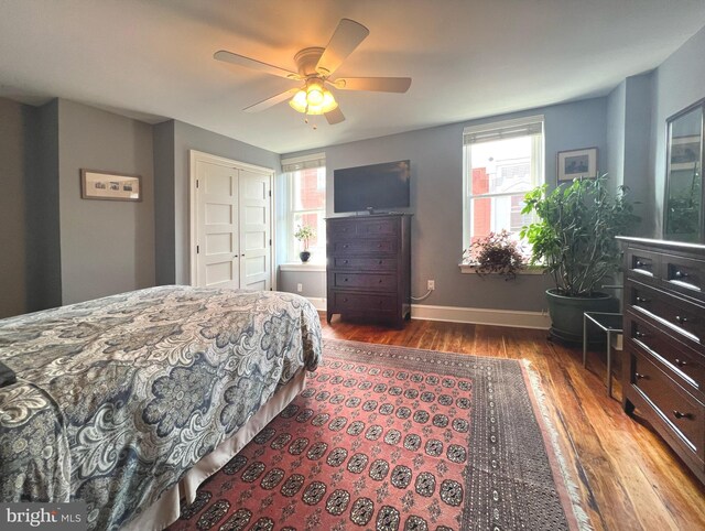 1303 N Newkirk St, Philadelphia, PA 19121 - bedroom featuring a ceiling fan, wood finished floors, baseboards, and multiple windows