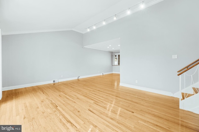 unfurnished living room featuring light wood-style floors, stairway, vaulted ceiling, and visible vents