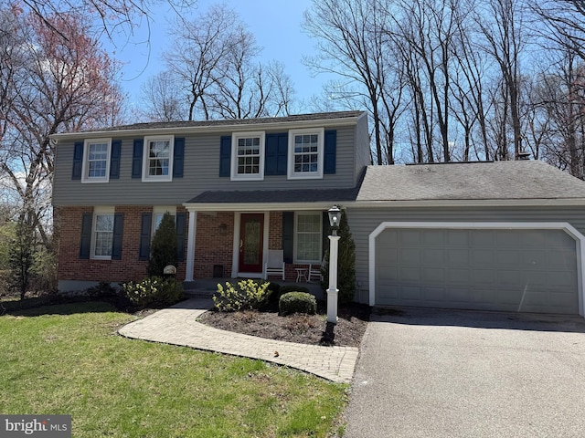 view of front of house with driveway, brick siding, an attached garage, a porch, and a front lawn