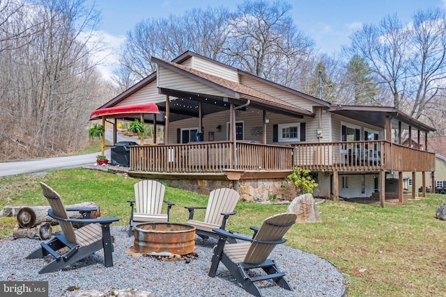 16 Jrs Dr, Mc Henry, MD 21541 - back of house with a lawn, a wooden deck, and an outdoor fire pit