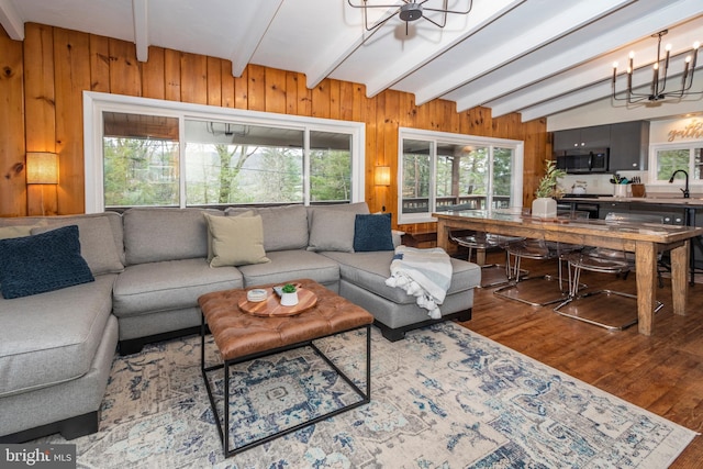 16 Jrs Dr, Mc Henry, MD 21541 - living area with wood walls, a chandelier, lofted ceiling with beams, and wood finished floors