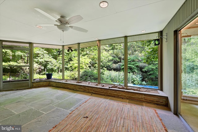 1408 Margarette Ave, Baltimore, MD 21286 - unfurnished sunroom with a ceiling fan and stone tile flooring