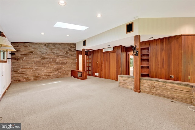 1408 Margarette Ave, Baltimore, MD 21286 - unfurnished living room with carpet, a skylight, recessed lighting, and wood walls