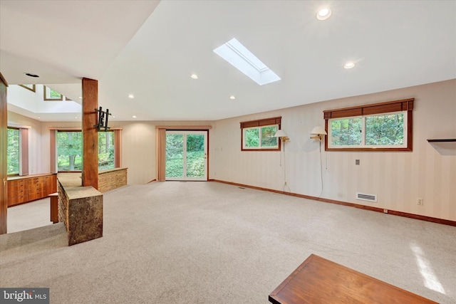 1408 Margarette Ave, Baltimore, MD 21286 - unfurnished living room with light colored carpet, plenty of natural light, a skylight, and recessed lighting