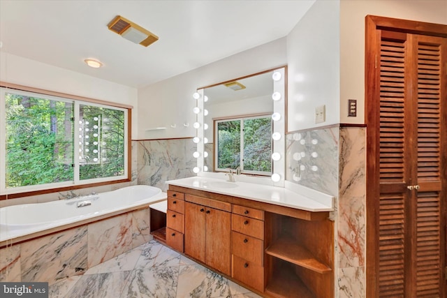 1408 Margarette Ave, Baltimore, MD 21286 - bathroom with marble finish flooring, tile walls, vanity, a closet, and a bath