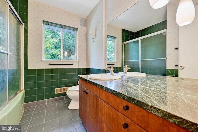 1408 Margarette Ave, Baltimore, MD 21286 - full bathroom featuring wallpapered walls, tile patterned flooring, vanity, healthy amount of natural light, and tile walls