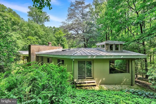 1408 Margarette Ave, Baltimore, MD 21286 - rear view of property with a standing seam roof and a metal roof