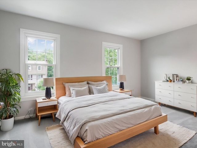 12617 Monarch Ct, Woodbridge, VA 22192 - bedroom with baseboards and light carpet