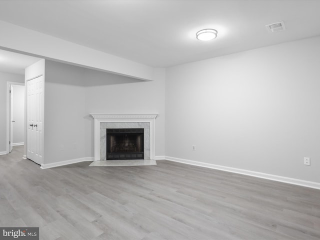 12617 Monarch Ct, Woodbridge, VA 22192 - unfurnished living room featuring a fireplace, wood finished floors, and baseboards