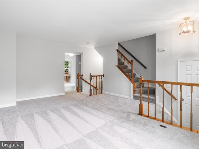 12617 Monarch Ct, Woodbridge, VA 22192 - unfurnished room with carpet flooring, baseboards, and a chandelier