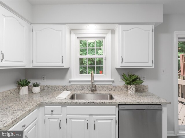 12617 Monarch Ct, Woodbridge, VA 22192 - kitchen featuring stainless steel dishwasher, a sink, white cabinetry, and plenty of natural light