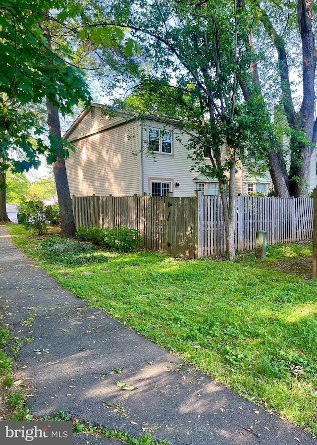 view of property exterior featuring fence