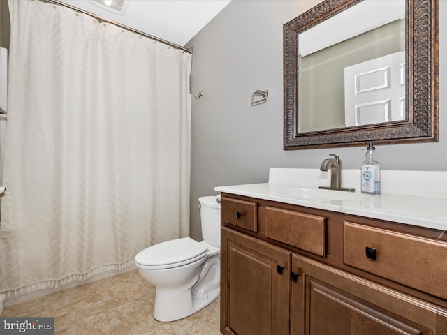 bathroom with toilet, vanity, and a shower with curtain