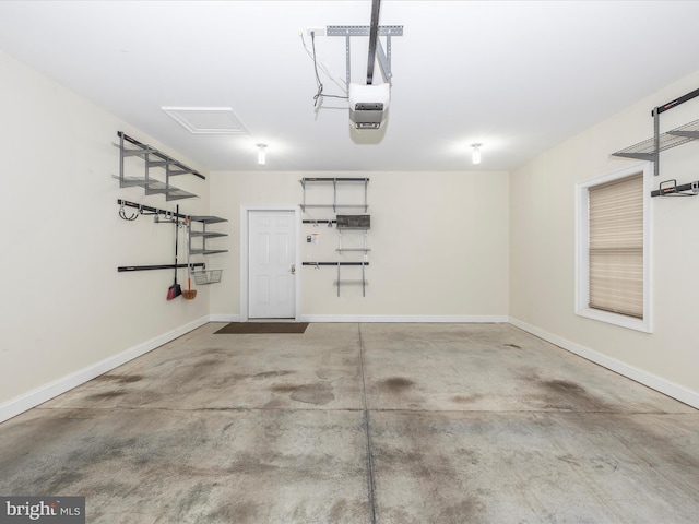 garage with baseboards and a garage door opener