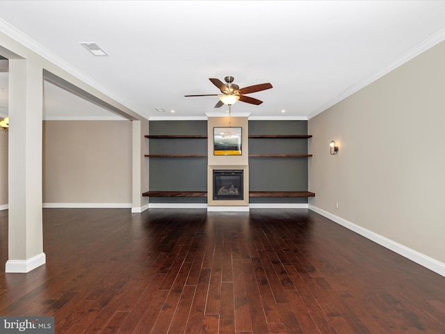 unfurnished living room featuring hardwood / wood-style floors, a glass covered fireplace, a ceiling fan, and visible vents