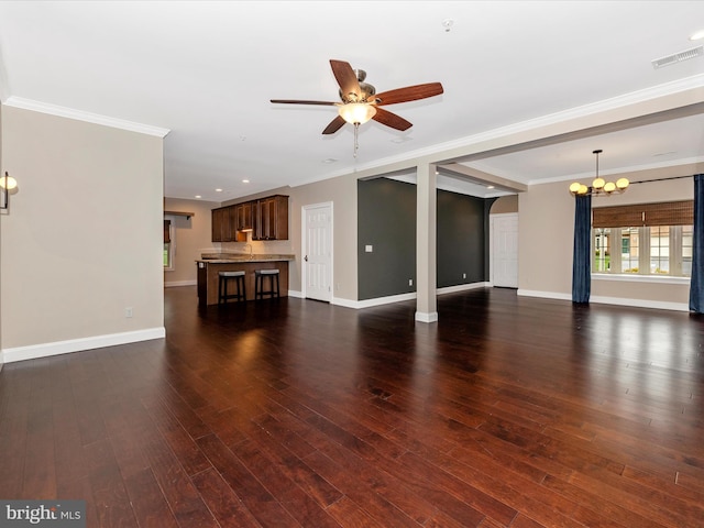 unfurnished living room with crown molding, wood finished floors, ceiling fan with notable chandelier, baseboards, and visible vents